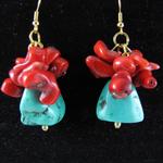 Goldplated fish hook earrings created with dyed Howlite Turquoise nuggets and natural sea Coral finished with a vintage gold bead.  