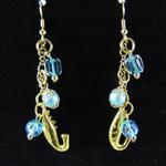 Goldplated fish hook earrings created with vintage gold chains; vintage baby blue beads finished with goldplated caps; vintage Aurora Borealis crystal bead; art glass; and 18K Yellow Goldplated over copper shrimp charms.  AVAILABLE 